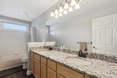 Step into this stunning 4-bedroom brick colonial located in the on Oakhurst Golf and Country Club in Michigan - for sale on GolfHomes.com, golf home, golf lot