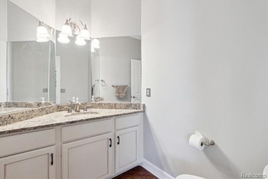 Step into this stunning 4-bedroom brick colonial located in the on Oakhurst Golf and Country Club in Michigan - for sale on GolfHomes.com, golf home, golf lot