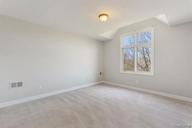 Step into this stunning 4-bedroom brick colonial located in the on Oakhurst Golf and Country Club in Michigan - for sale on GolfHomes.com, golf home, golf lot
