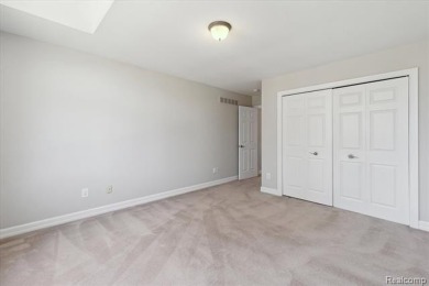 Step into this stunning 4-bedroom brick colonial located in the on Oakhurst Golf and Country Club in Michigan - for sale on GolfHomes.com, golf home, golf lot