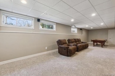 Step into this stunning 4-bedroom brick colonial located in the on Oakhurst Golf and Country Club in Michigan - for sale on GolfHomes.com, golf home, golf lot