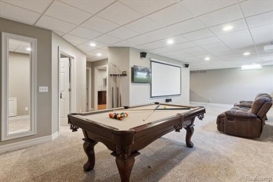 Step into this stunning 4-bedroom brick colonial located in the on Oakhurst Golf and Country Club in Michigan - for sale on GolfHomes.com, golf home, golf lot
