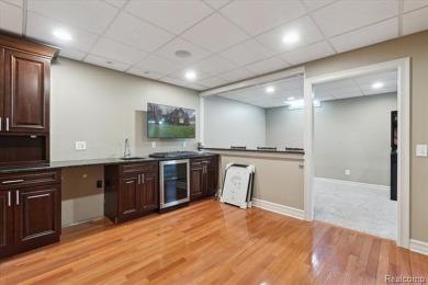 Step into this stunning 4-bedroom brick colonial located in the on Oakhurst Golf and Country Club in Michigan - for sale on GolfHomes.com, golf home, golf lot
