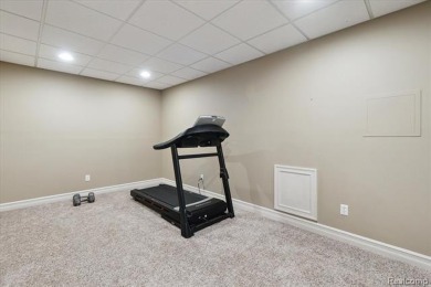 Step into this stunning 4-bedroom brick colonial located in the on Oakhurst Golf and Country Club in Michigan - for sale on GolfHomes.com, golf home, golf lot