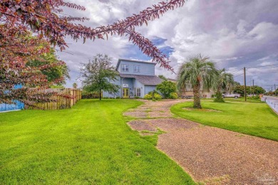 Welcome to this stunning home in the Santa Rosa Shores Canal on Tiger Point Golf and Country Club in Florida - for sale on GolfHomes.com, golf home, golf lot