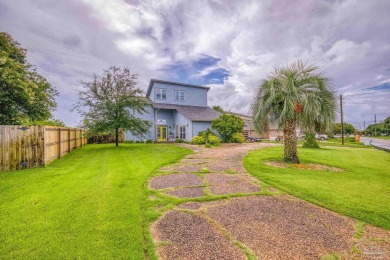 Welcome to this stunning home in the Santa Rosa Shores Canal on Tiger Point Golf and Country Club in Florida - for sale on GolfHomes.com, golf home, golf lot