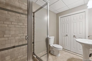 Step into this stunning 4-bedroom brick colonial located in the on Oakhurst Golf and Country Club in Michigan - for sale on GolfHomes.com, golf home, golf lot