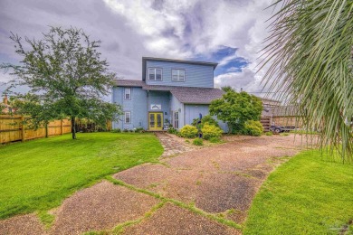 Welcome to this stunning home in the Santa Rosa Shores Canal on Tiger Point Golf and Country Club in Florida - for sale on GolfHomes.com, golf home, golf lot