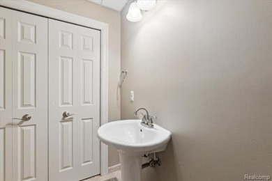Step into this stunning 4-bedroom brick colonial located in the on Oakhurst Golf and Country Club in Michigan - for sale on GolfHomes.com, golf home, golf lot