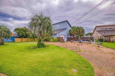 Welcome to this stunning home in the Santa Rosa Shores Canal on Tiger Point Golf and Country Club in Florida - for sale on GolfHomes.com, golf home, golf lot