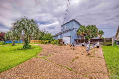 Welcome to this stunning home in the Santa Rosa Shores Canal on Tiger Point Golf and Country Club in Florida - for sale on GolfHomes.com, golf home, golf lot