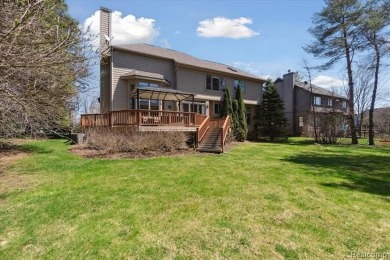 Step into this stunning 4-bedroom brick colonial located in the on Oakhurst Golf and Country Club in Michigan - for sale on GolfHomes.com, golf home, golf lot