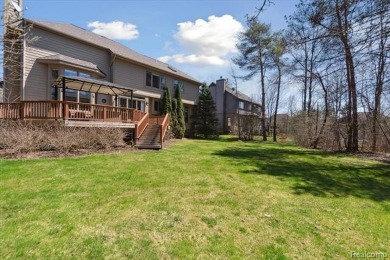 Step into this stunning 4-bedroom brick colonial located in the on Oakhurst Golf and Country Club in Michigan - for sale on GolfHomes.com, golf home, golf lot