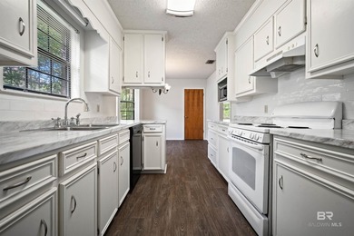 Welcome home to this lovely 3 bedroom 2 bathroom brick ranch on on Lake Forest Yacht and Country Club in Alabama - for sale on GolfHomes.com, golf home, golf lot