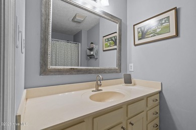 Nestled beneath a canopy of mature longleaf pines, this charming on Hyland Golf Club in North Carolina - for sale on GolfHomes.com, golf home, golf lot