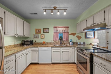 Nestled beneath a canopy of mature longleaf pines, this charming on Hyland Golf Club in North Carolina - for sale on GolfHomes.com, golf home, golf lot