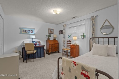 Nestled beneath a canopy of mature longleaf pines, this charming on Hyland Golf Club in North Carolina - for sale on GolfHomes.com, golf home, golf lot