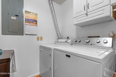 Nestled beneath a canopy of mature longleaf pines, this charming on Hyland Golf Club in North Carolina - for sale on GolfHomes.com, golf home, golf lot