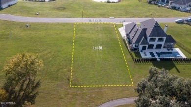 Beautiful lot overlooking Fairway #5 in the Exclusive Gated on LeTriomphe Golf and Country Club in Louisiana - for sale on GolfHomes.com, golf home, golf lot