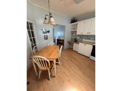 MOTIVATED SELLER! Tucked away in a peaceful Winter Haven 55+ on Lake Henry Golf Club in Florida - for sale on GolfHomes.com, golf home, golf lot