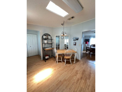 MOTIVATED SELLER! Tucked away in a peaceful Winter Haven 55+ on Lake Henry Golf Club in Florida - for sale on GolfHomes.com, golf home, golf lot