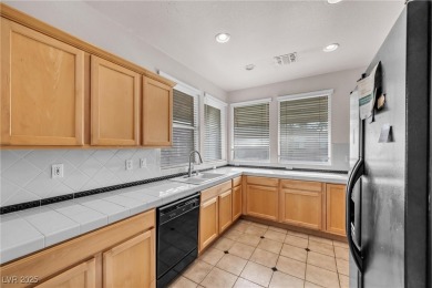 Discover luxury living in this stunning two-story corner unit on TPC at Summerlin in Nevada - for sale on GolfHomes.com, golf home, golf lot