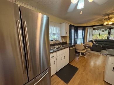 MOTIVATED SELLER! Don't miss this spacious, beautiful home in on Lake Henry Golf Club in Florida - for sale on GolfHomes.com, golf home, golf lot