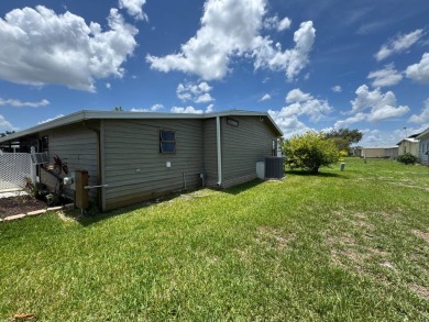 MOTIVATED SELLER! Don't miss this spacious, beautiful home in on Lake Henry Golf Club in Florida - for sale on GolfHomes.com, golf home, golf lot