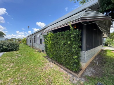 MOTIVATED SELLER! Don't miss this spacious, beautiful home in on Lake Henry Golf Club in Florida - for sale on GolfHomes.com, golf home, golf lot