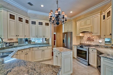 This gracious, charming pool home with large wrap around porch on Haile Plantation Golf and Country Club in Florida - for sale on GolfHomes.com, golf home, golf lot