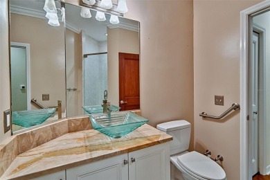 This gracious, charming pool home with large wrap around porch on Haile Plantation Golf and Country Club in Florida - for sale on GolfHomes.com, golf home, golf lot