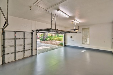 This gracious, charming pool home with large wrap around porch on Haile Plantation Golf and Country Club in Florida - for sale on GolfHomes.com, golf home, golf lot