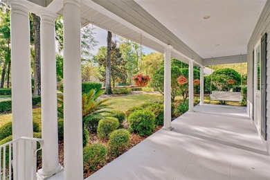 This gracious, charming pool home with large wrap around porch on Haile Plantation Golf and Country Club in Florida - for sale on GolfHomes.com, golf home, golf lot