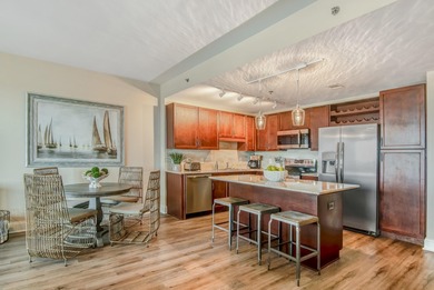 Step inside this beautifully maintained Laketown Wharf condo on Signal Hill Golf Course, Inc. in Florida - for sale on GolfHomes.com, golf home, golf lot