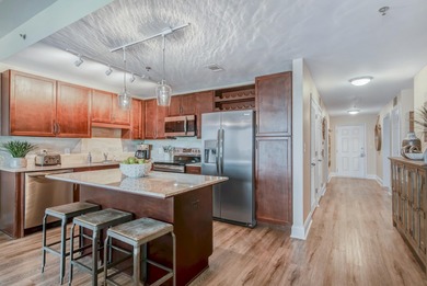 Step inside this beautifully maintained Laketown Wharf condo on Signal Hill Golf Course, Inc. in Florida - for sale on GolfHomes.com, golf home, golf lot