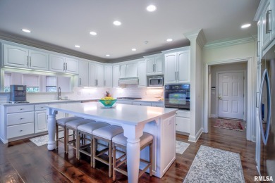This custom built all brick home situated on the signature fifth on WeaverRidge Golf Club in Illinois - for sale on GolfHomes.com, golf home, golf lot