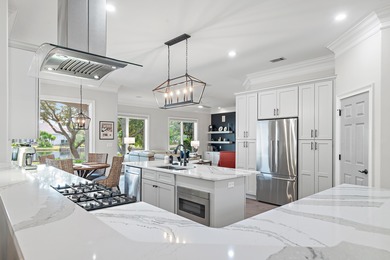 Experience refined coastal living at 463 Captains Circle, a on Regatta Bay Golf and Country Club in Florida - for sale on GolfHomes.com, golf home, golf lot