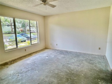 This rare 1 bed/1 bath, first floor end unit is waiting for you on On Top Of The World Golf Course in Florida - for sale on GolfHomes.com, golf home, golf lot