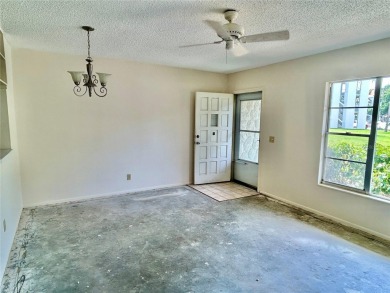 This rare 1 bed/1 bath, first floor end unit is waiting for you on On Top Of The World Golf Course in Florida - for sale on GolfHomes.com, golf home, golf lot