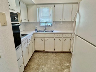 This rare 1 bed/1 bath, first floor end unit is waiting for you on On Top Of The World Golf Course in Florida - for sale on GolfHomes.com, golf home, golf lot