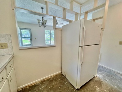 This rare 1 bed/1 bath, first floor end unit is waiting for you on On Top Of The World Golf Course in Florida - for sale on GolfHomes.com, golf home, golf lot