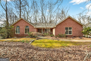 Welcome to this expansive four-sided brick ranch home situated on Lake Spivey Golf Club in Georgia - for sale on GolfHomes.com, golf home, golf lot