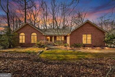 Welcome to this expansive four-sided brick ranch home situated on Lake Spivey Golf Club in Georgia - for sale on GolfHomes.com, golf home, golf lot