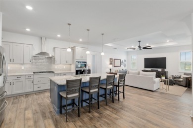 Gorgeous ALMOST NEW 2024 home in Candler Hills in On Top of the on On Top of the World Golf Course in Florida - for sale on GolfHomes.com, golf home, golf lot