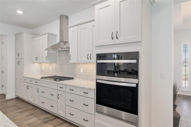 Gorgeous ALMOST NEW 2024 home in Candler Hills in On Top of the on On Top of the World Golf Course in Florida - for sale on GolfHomes.com, golf home, golf lot
