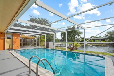 Welcome to your waterfront oasis in Sunrise Golf Village! This on Sunrise Lakes Phase III in Florida - for sale on GolfHomes.com, golf home, golf lot