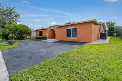 Welcome to your waterfront oasis in Sunrise Golf Village! This on Sunrise Lakes Phase III in Florida - for sale on GolfHomes.com, golf home, golf lot