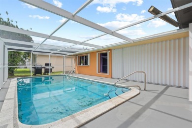Welcome to your waterfront oasis in Sunrise Golf Village! This on Sunrise Lakes Phase III in Florida - for sale on GolfHomes.com, golf home, golf lot