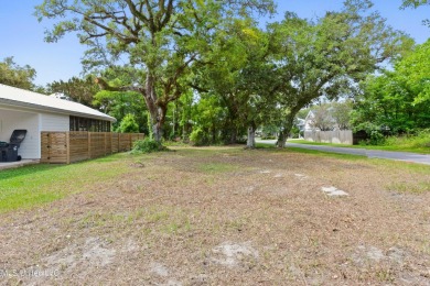 Corner lot adorned with magnificent live oaks, nestled in the on The Bridges Golf Club At Hollywood Casino in Mississippi - for sale on GolfHomes.com, golf home, golf lot