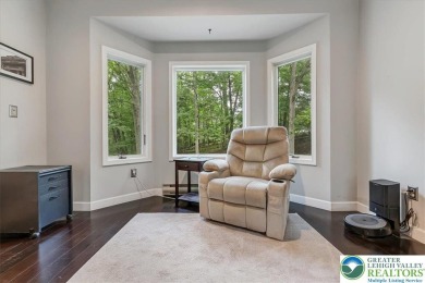 Located in the amenity-filled golf course community Country Club on Country Club of the Poconos Golf Course in Pennsylvania - for sale on GolfHomes.com, golf home, golf lot